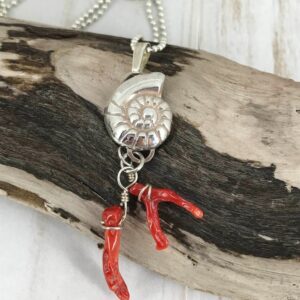 Fine silver nautilus with branch coral - a picture of the sea