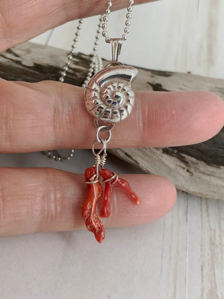 Fine silver nautilus with branch coral - a picture of the sea